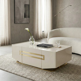 Modern living room with a beige coffee table, vase with a flower, and a book.