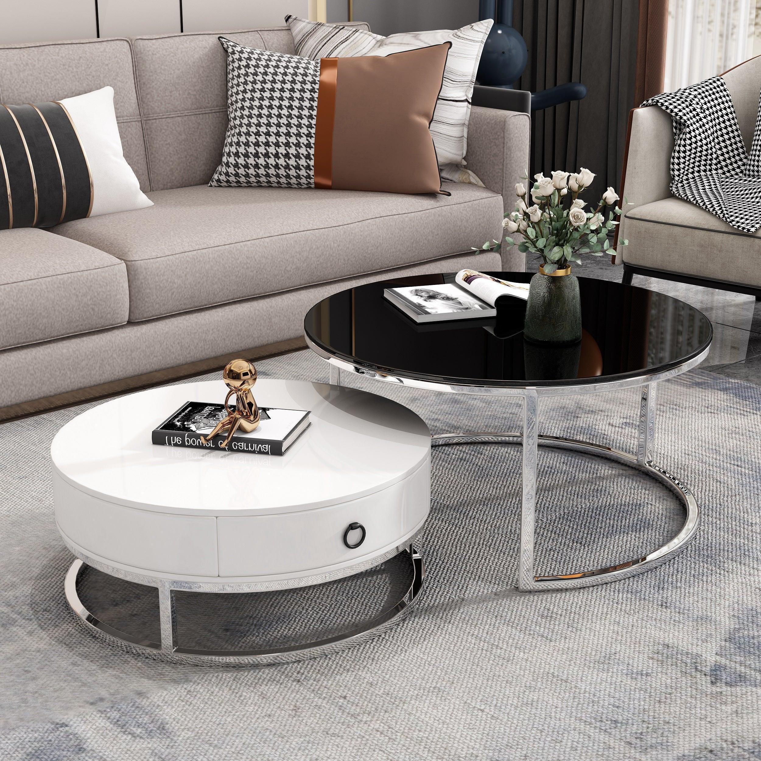 Image of The A2Z Furniture's Dodo Coffee Table set in white with silver accents and black tempered glass. The set includes a larger round table and a smaller nesting table with a storage drawer