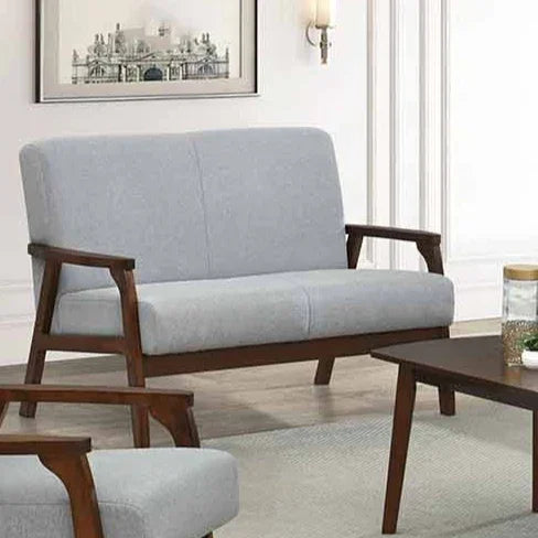Light gray sofa with wooden frame in a living room setting