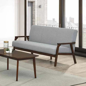 Gray sofa with wooden frame in a modern living room setting