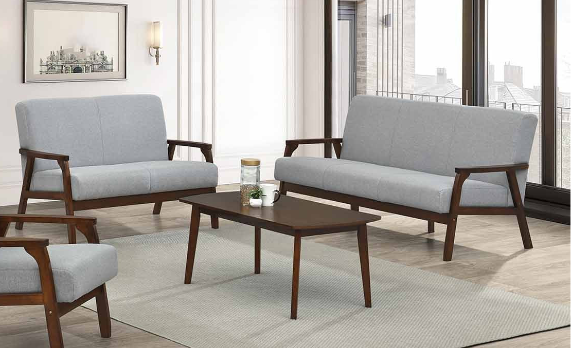 Modern living room furniture set with gray cushions and wooden frames.