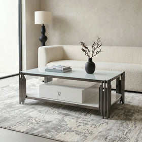 Modern living room with a coffee table, lamp, and vase.