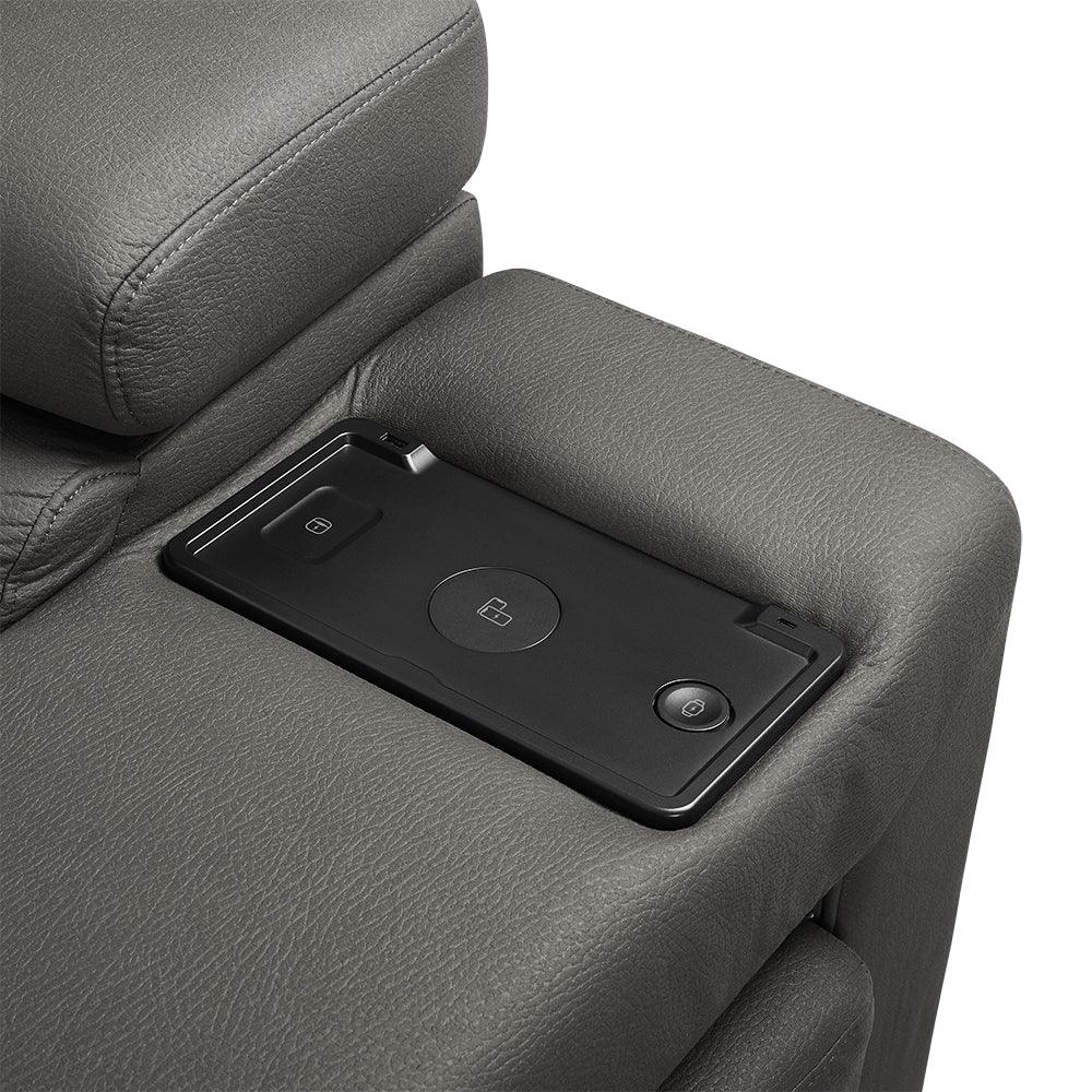 Grey leather sofa armrest with built-in wireless charging pad and controls