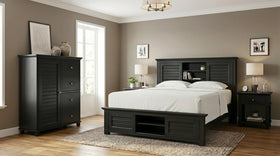 Warwick 4 Piece Tallboy Bedroom Suite in black timber with louvre bookcase bed, two bedside tables and matching tallboy, shown in a warm-toned bedroom - The A2Z Furniture