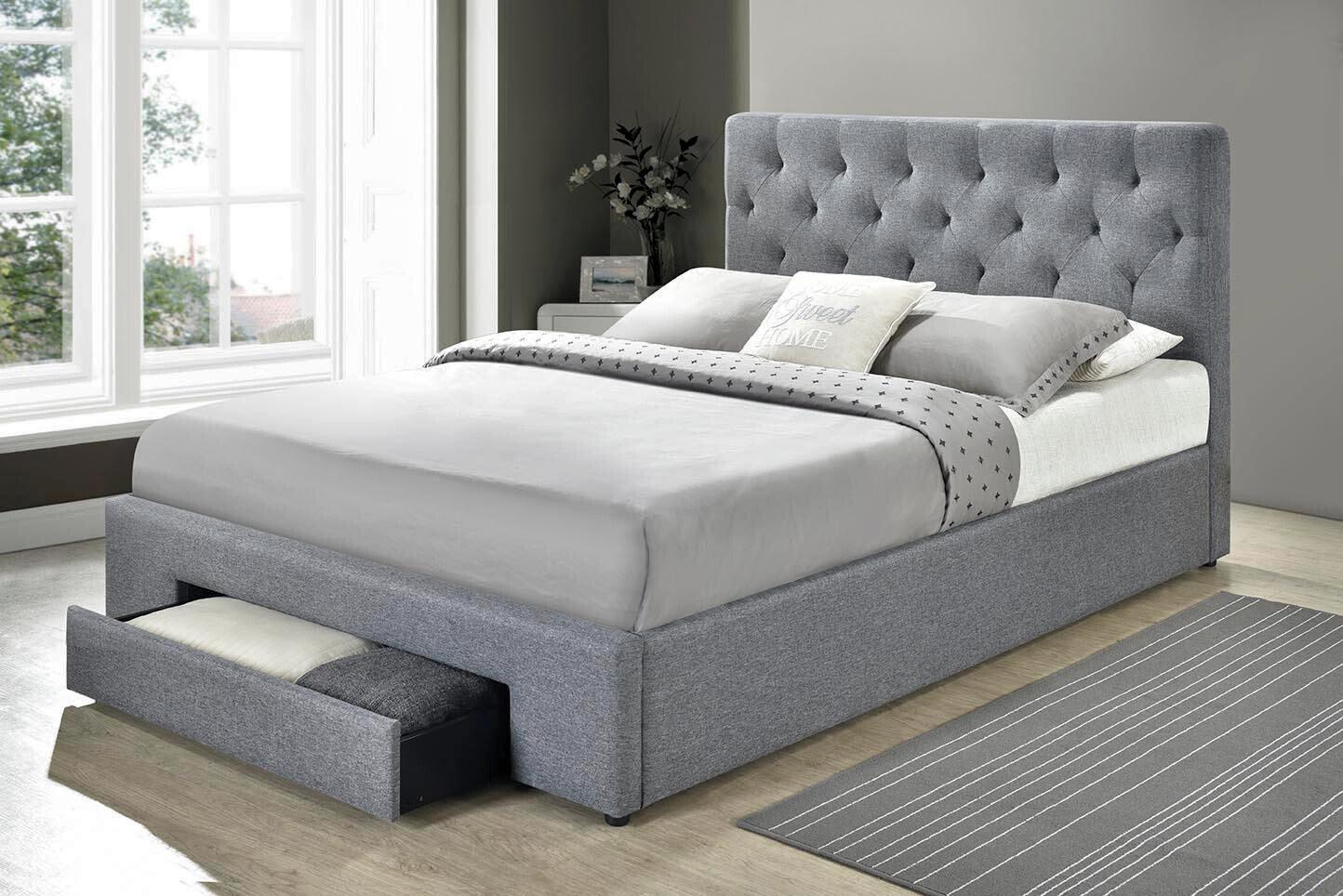 Grey upholstered bed with underbed storage drawer in modern bedroom