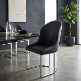 Darkwood Black Dining Chair in black PU faux leather with curved high back and polished chrome sled base, shown beside a dark dining table - The A2Z Furniture