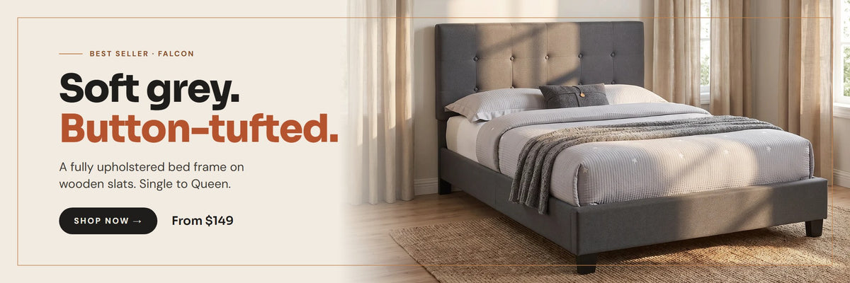 Falcon grey fabric button-tufted bed frame in a sunlit bedroom