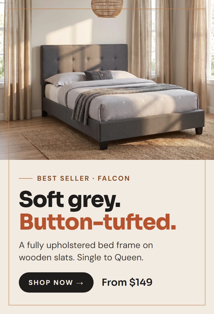Falcon grey fabric button-tufted bed frame in a sunlit bedroom