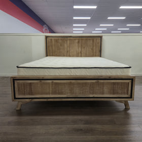 Jack Acacia Bed Frame front elevation in natural acacia timber with black trim edge, shown on display in The A2Z Furniture showroom (mattress shown not included)