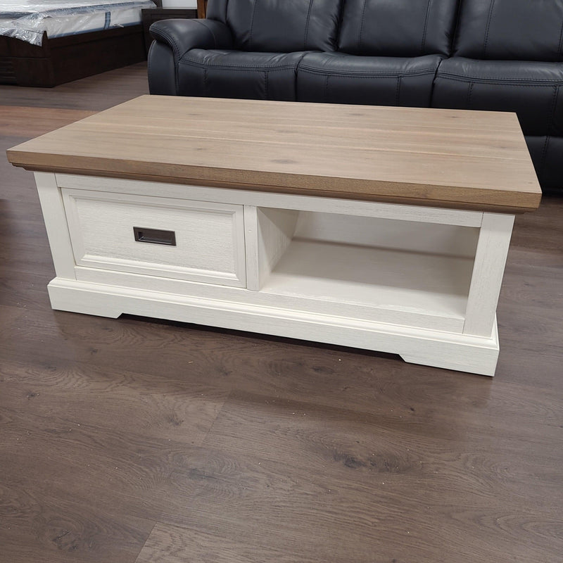 Jericho Coffee Table by The A2Z Furniture - Coastal-inspired Hamptons style design with solid acacia wood construction and sliding door shelf for storage.