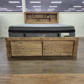 Close-up of the Joyner Bookcase Bed Frame weathered timber headboard, showing the open shelving section and closed panel door.