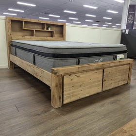 Joyner Bookcase Bed Frame in weathered timber finish, angled showroom view at The A2Z Furniture showroom. Mattress shown is not included.