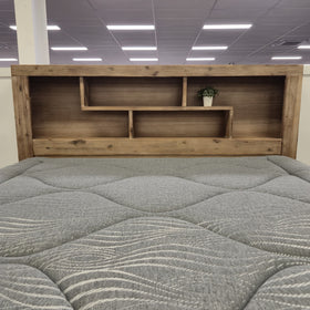 Joyner Bookcase Bed Frame in weathered timber finish, full showroom view showing headboard bookcase shelving, at The A2Z Furniture showroom. Mattress shown is not included.