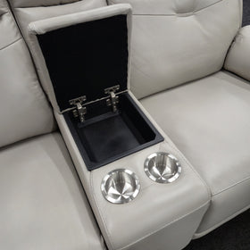 Lalor 2 Seater electric leather recliner lounge centre console open, showing the lined storage compartment and two stainless steel cupholders in silver grey leather