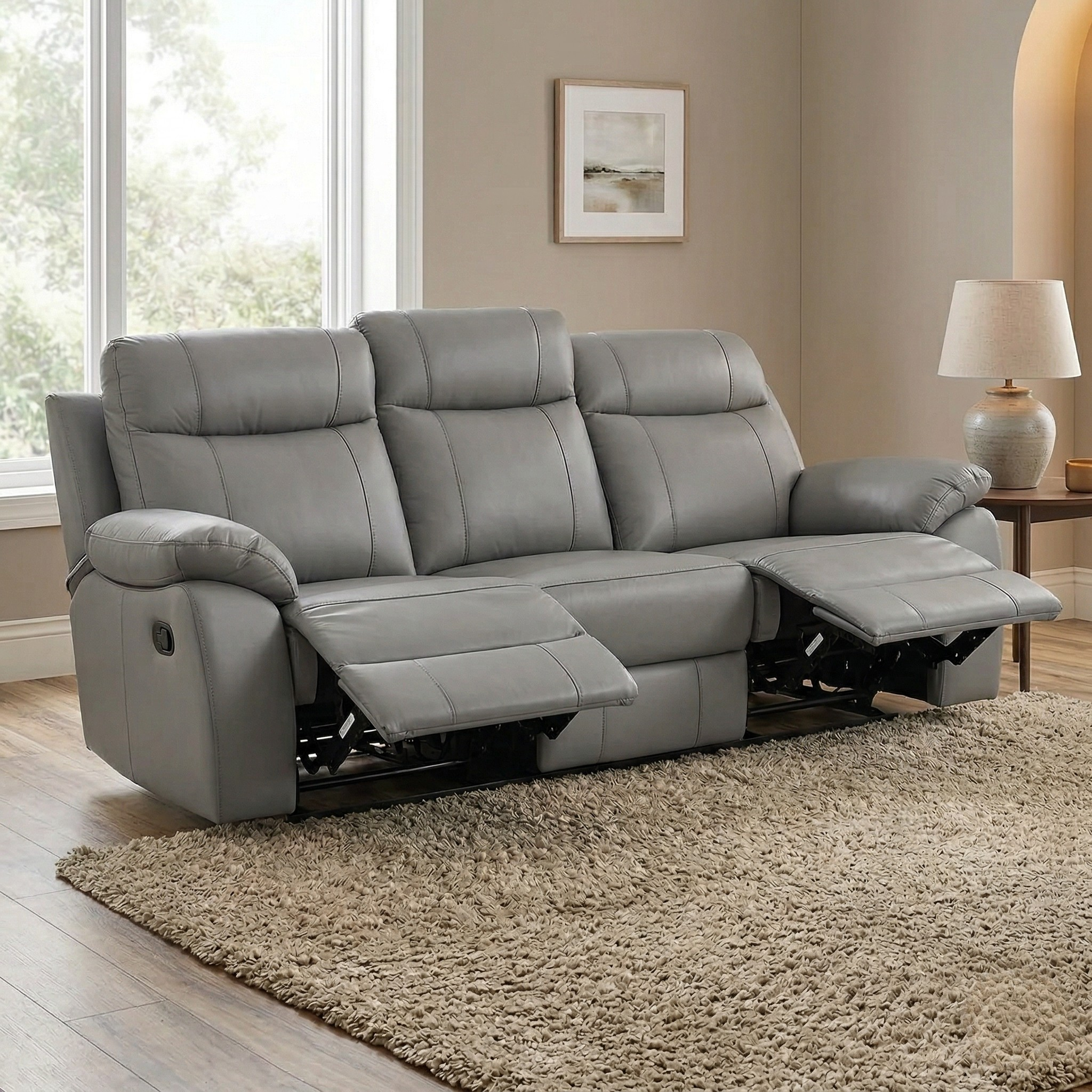 Latrobe 3 Seater Leather Recliner Lounge in gray with padded armrests and backrests, shown in a cozy living room setting with reclined footrests for added comfort.