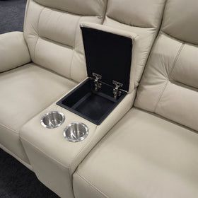 Lemington 2 Seater Leather Recliner Lounge in beige, centre console lid open showing the lined storage compartment and two stainless steel cup holders