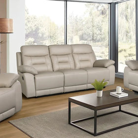Off-white leather recliner sofa in modern living room with coffee table and large windows