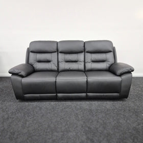 Modern three-seater black leather recliner sofa with wide armrests on carpeted floor