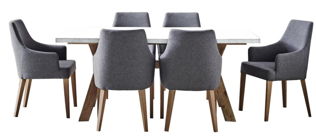 Liberty 7 Piece Dining Set - white concrete top table with grey Charleston dining chairs, studio shot