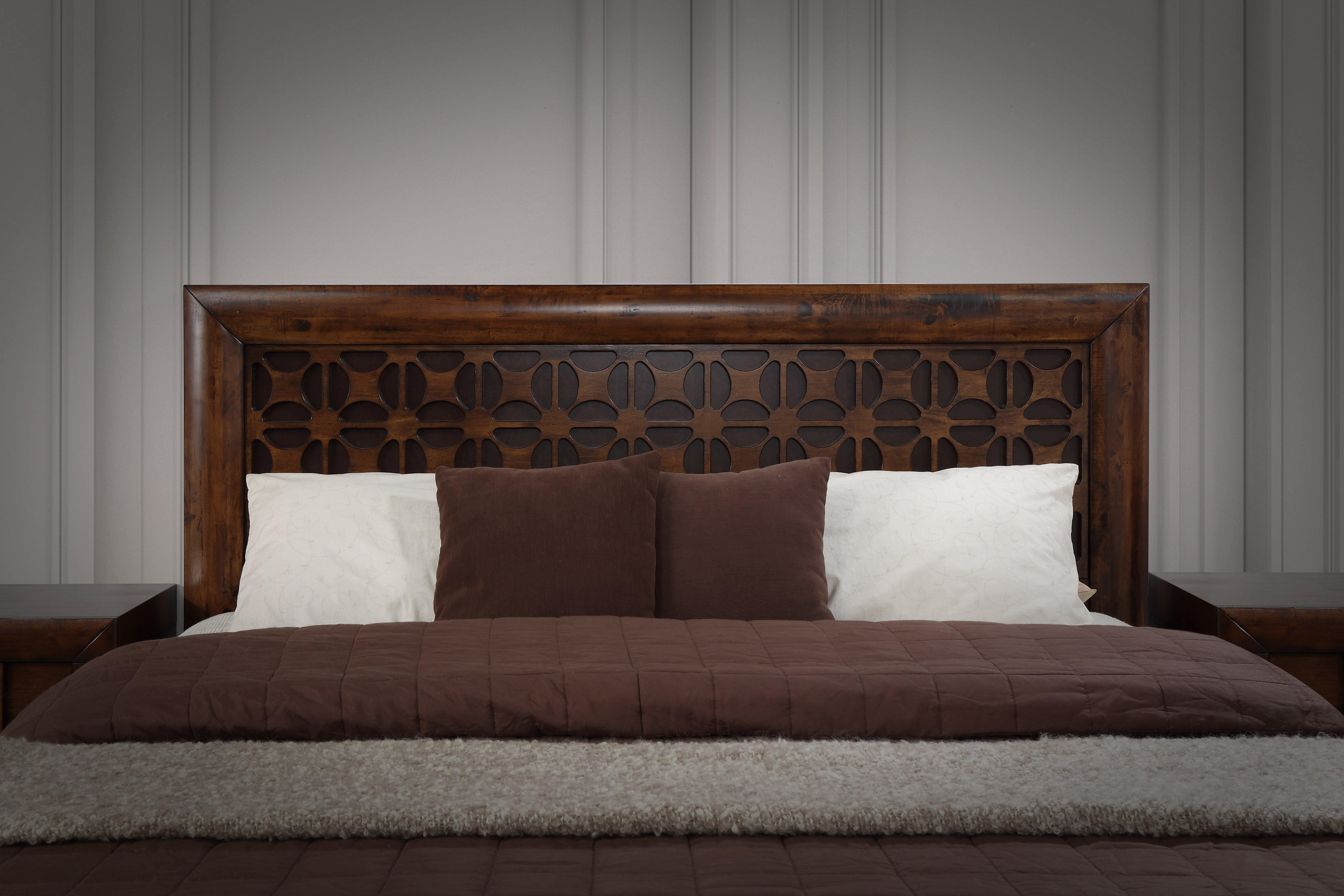 Image of The A2Z Furniture's Lilly bed - a wooden bed frame with gas lift storage drawer, available in queen and king sizes, with a traditional carved headboard design.