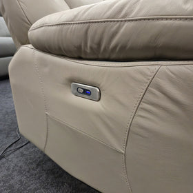 Close-up of the brushed metal electric recline control with illuminated indicator on the outer arm of the Limestone 3 Seater Electric Leather Recliner Lounge, showing the leather grain and contrast stitching