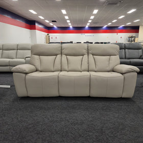 Limestone 3 Seater Electric Leather Recliner Lounge viewed straight on, showing three seat cushions and pillow-top arms, on display in The A2Z Furniture showroom