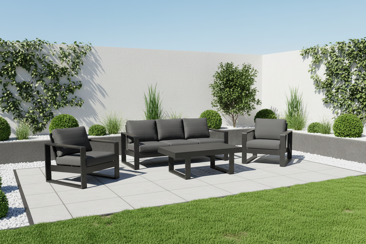 Garden furniture set with sofa and chairs on a patio area with greenery.