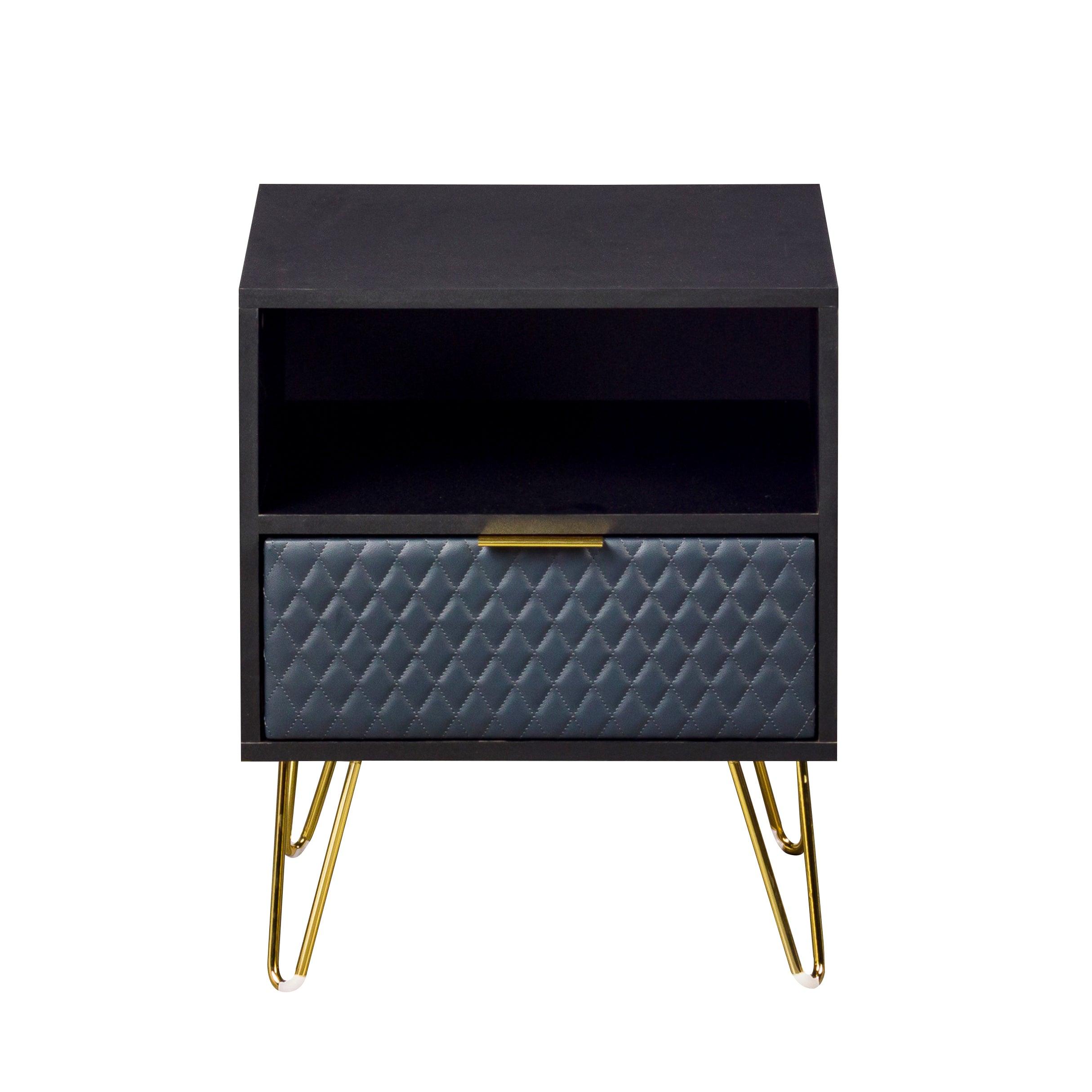 Modern black bedside table with gold legs, open shelf, and quilted drawer front