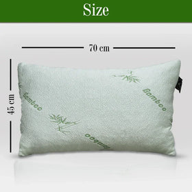 Green pillow with 'Bamboo' text and measurements on a white background