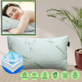 Bamboo pillow with a woman sleeping inset, plant, and product features on a wooden surface.