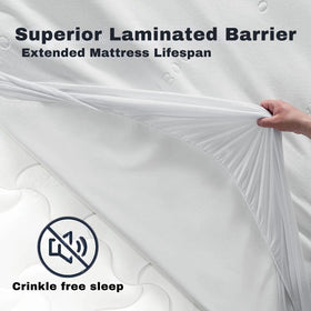 Hand lifting a white mattress protector showing laminated barrier for crinkle free sleep