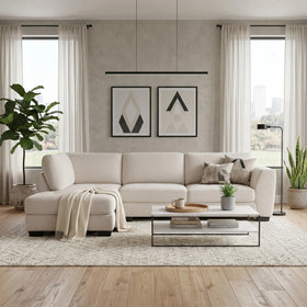 Melton Chaise Lounge in a bright, modern living room setting with neutral tones, featuring a cream fabric sectional sofa and minimalist decor.