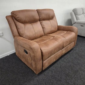 Milano 2 Seater Recliner Lounge in brown fabric, angled view showing the manual recliner pull handle on the arm, on display in The A2Z Furniture showroom