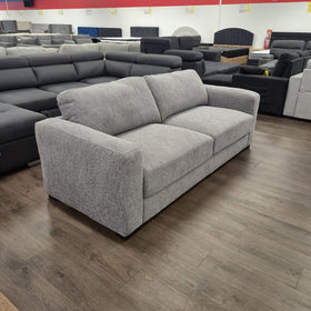 Montana 3 Seater Fabric Sofa in Galaxy Dusk grey, three-quarter angled view showing the wide track arms, at The A2Z Furniture showroom