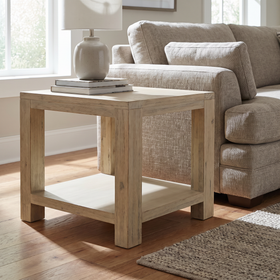 Nelson Lamp Table in solid acacia with an open lower shelf, styled beside a sofa in a sunlit living room