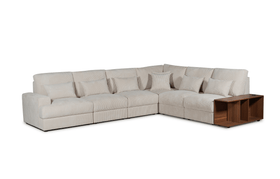 Beige fabric corner lounge sofa with multiple cushions and built-in wooden side table