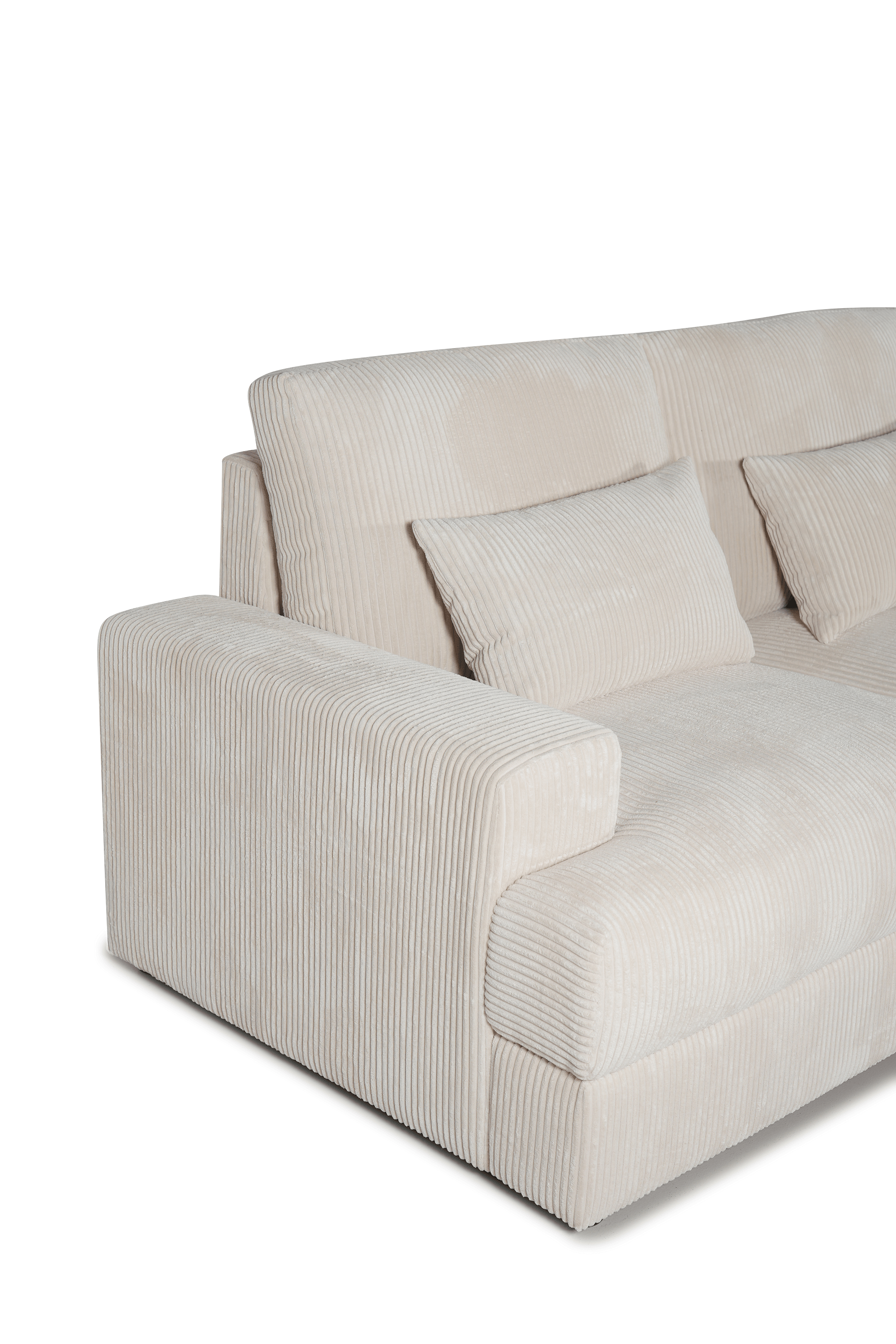 Beige corduroy sofa with wide armrest and matching cushions, modern lounge furniture