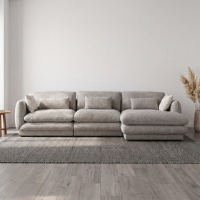Otway L-Shaped Fabric Lounge in Grey styled in a living room, left-hand chaise