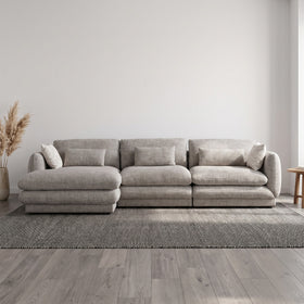 Otway L-Shaped Fabric Lounge in Grey styled in a living room, right-hand chaise
