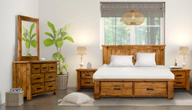 Rustic timber bedroom suite with bed, bedside tables, dresser and mirror in a modern room