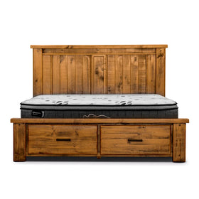 Rustic wooden bed frame with headboard and two storage drawers, shown with mattress