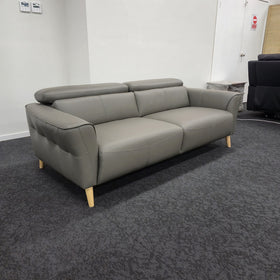 Penelope 3 Seater Leather Lounge in Anthracite viewed from an angle showing the flared arms and seat cushions, at The A2Z Furniture showroom