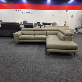 Penguine Leather Corner Chaise Sofa in olive leather, front-on view with adjustable headrests up, on display at The A2Z Furniture showroom