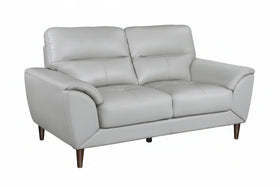 Gray leather sofa on a white background