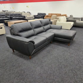 Penrith 3 Seater Leather Sofa with Chaise in black leather, three-quarter view showing the adjustable headrests and curved arms, at The A2Z Furniture showroom