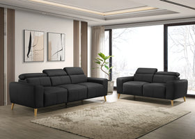 Modern living room with two black sofas and a large window.