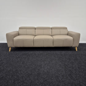 Percy 3 Seater Leather Lounge in Khaki shown front-on with all three adjustable headrests raised, at The A2Z Furniture showroom
