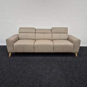 Percy 3 Seater Leather Lounge in Khaki with the outer headrests raised and the centre headrest lowered, showing the adjustable headrest positions, at The A2Z Furniture showroom