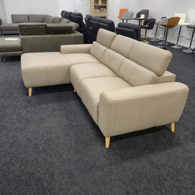 Percy 3 seater leather lounge with chaise in khaki, rear three-quarter view showing the stitched back panels and timber legs, in The A2Z Furniture showroom