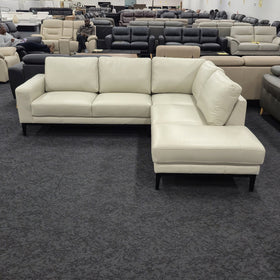 Plenty Leather Chaise Lounge in Light Grey leather, angled front view with the left-hand chaise when sitting, in The A2Z Furniture showroom